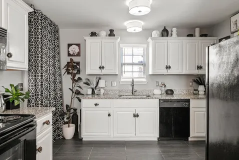 a kitchen with a stove and a cabinets