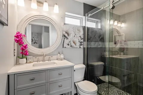 a bathroom with a sink toilet and shower
