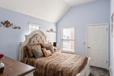 a utility room with dryer washer and a view of kitchen