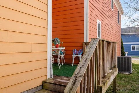 a view of a house with a yard and plants