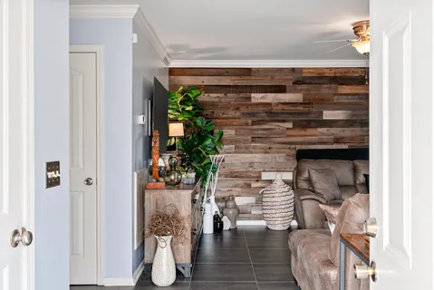 a living room with furniture and a large window