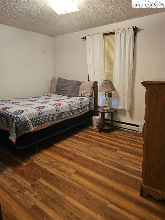 189 Pine Loop Newland, NC 28657 - Photo 12 of 17 a bedroom with a bed and a mirror