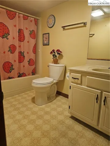 a white toilet sitting next to a bathroom sink