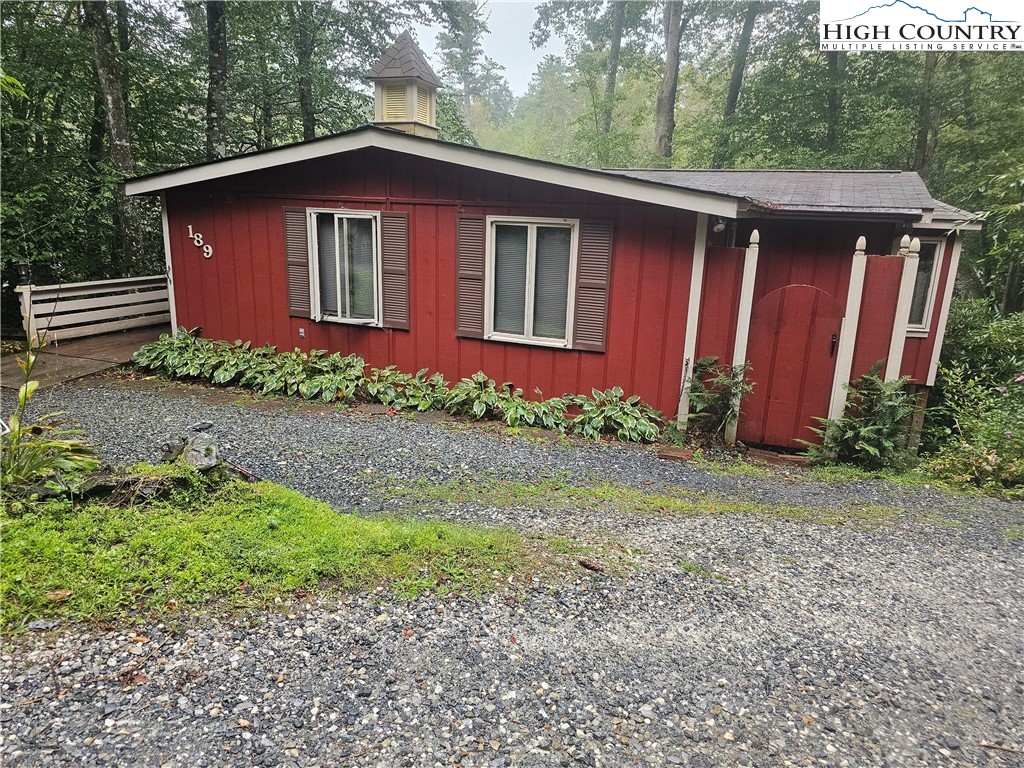 189 Pine Loop Newland, NC 28657 - Photo 2 of 17 a view of a house with a yard