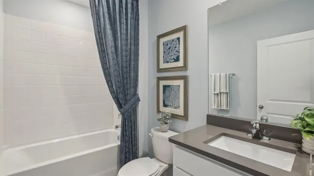 a bedroom with a bed and cabinet