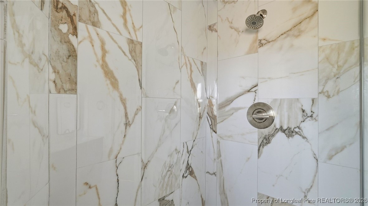 10765 Barker 10 Mile Road St. Pauls, NC 28384 - Photo 17 of 48 a bathroom with a shower