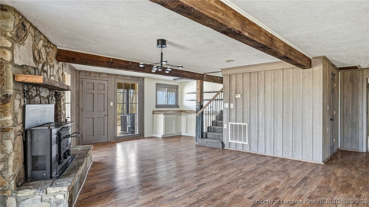 10765 Barker 10 Mile Road St. Pauls, NC 28384 - Photo 18 of 48 a view of a kitchen with a refrigerator a stove top oven and cabinets