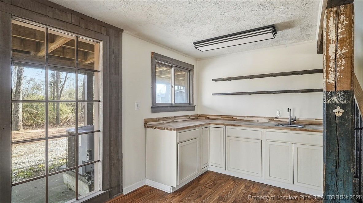 10765 Barker 10 Mile Road St. Pauls, NC 28384 - Photo 20 of 48 a kitchen with stainless steel appliances granite countertop cabinets and window