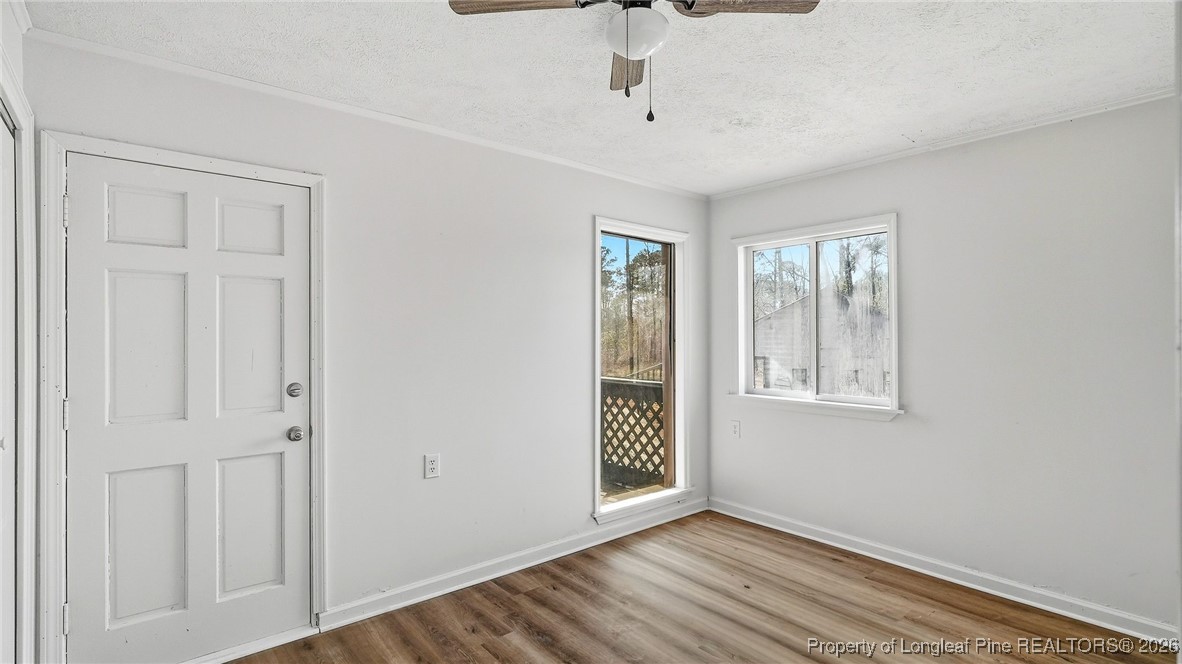 10765 Barker 10 Mile Road St. Pauls, NC 28384 - Photo 24 of 48 a view of an empty room with closet and a window