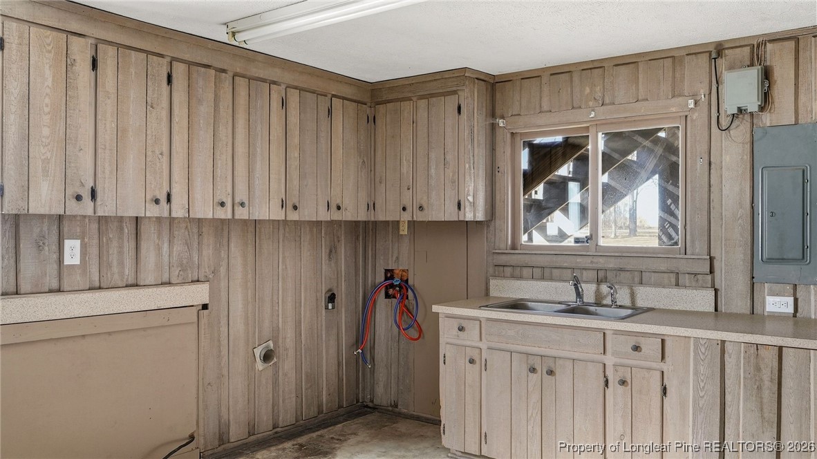 10765 Barker 10 Mile Road St. Pauls, NC 28384 - Photo 26 of 48 a bathroom with a sink and a mirror