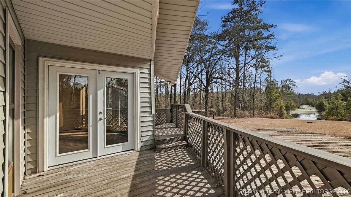 10765 Barker 10 Mile Road St. Pauls, NC 28384 - Photo 27 of 48 a view of a balcony and car parked