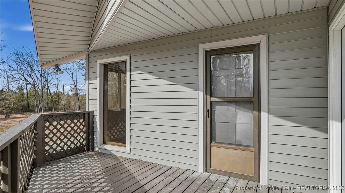 10765 Barker 10 Mile Road St. Pauls, NC 28384 - Photo 28 of 48 a view of a wooden door and a window