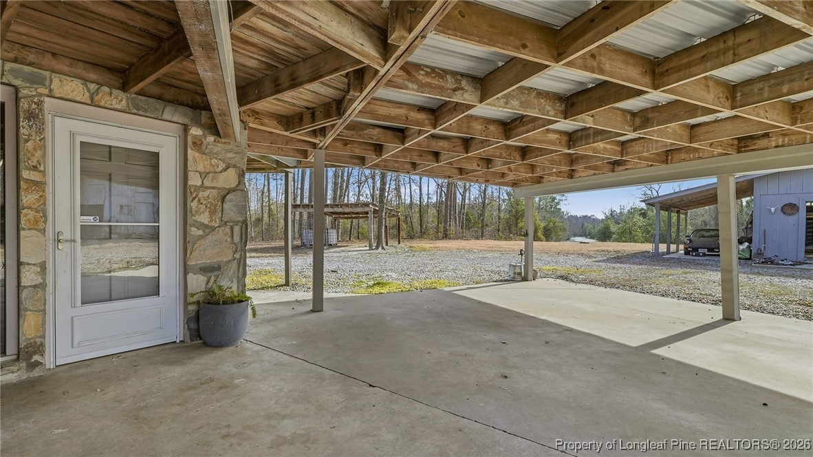 10765 Barker 10 Mile Road St. Pauls, NC 28384 - Photo 34 of 48 a view of a room with wooden floor