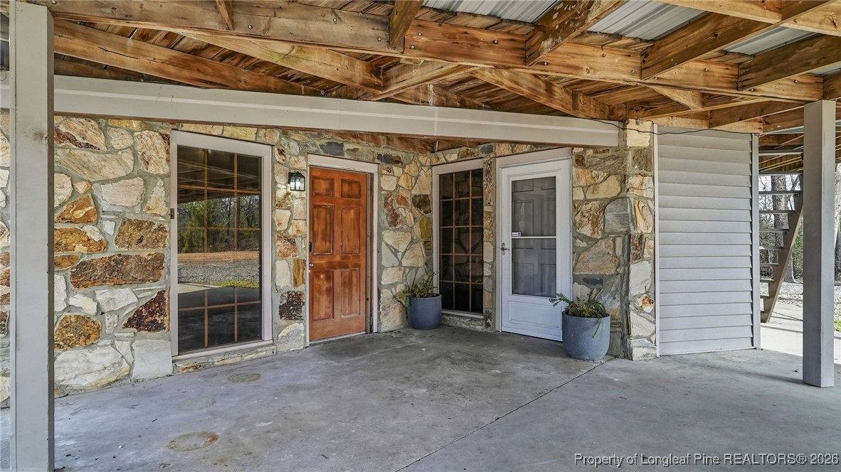 10765 Barker 10 Mile Road St. Pauls, NC 28384 - Photo 35 of 48 a view of a building with door