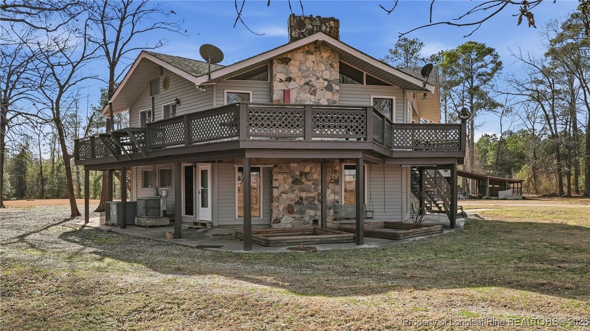 10765 Barker 10 Mile Road St. Pauls, NC 28384 - Photo 36 of 48 a view of a house with a outdoor space