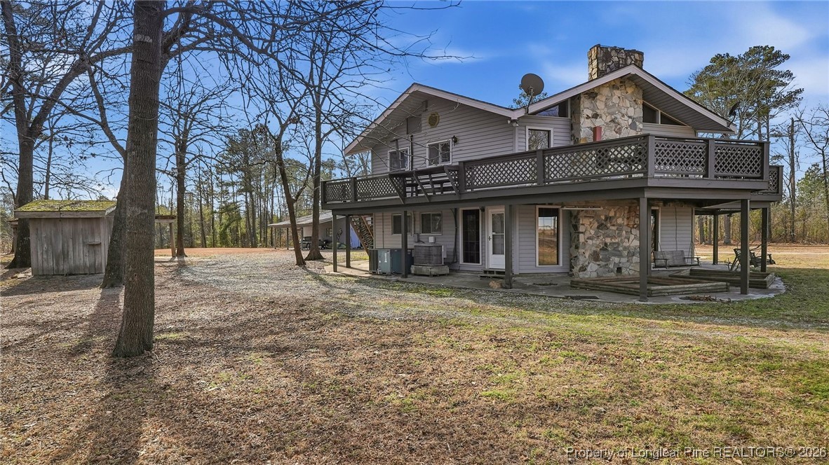 10765 Barker 10 Mile Road St. Pauls, NC 28384 - Photo 37 of 48 a front view of a house with garden