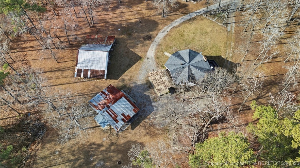 10765 Barker 10 Mile Road St. Pauls, NC 28384 - Photo 42 of 48 an aerial view of a house with a yard and wooden fence