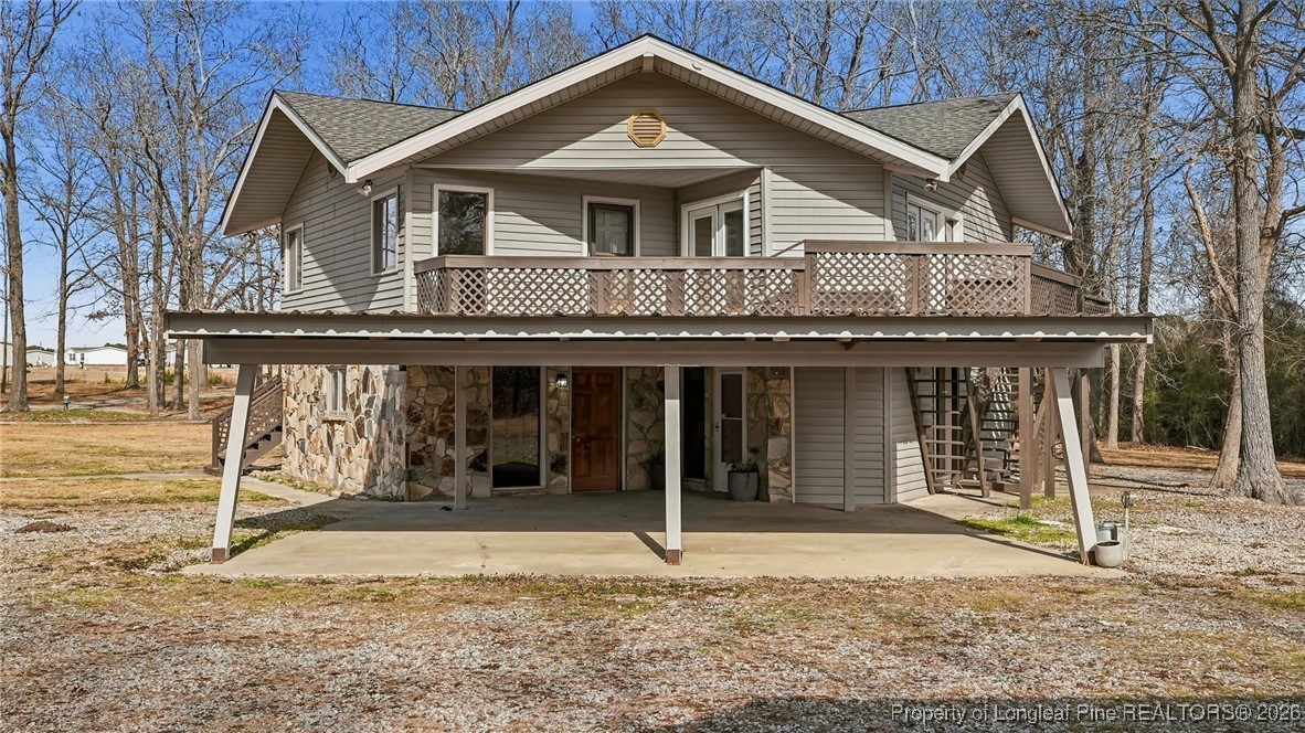 10765 Barker 10 Mile Road St. Pauls, NC 28384 - Photo 48 of 48 a front view of a house with garden
