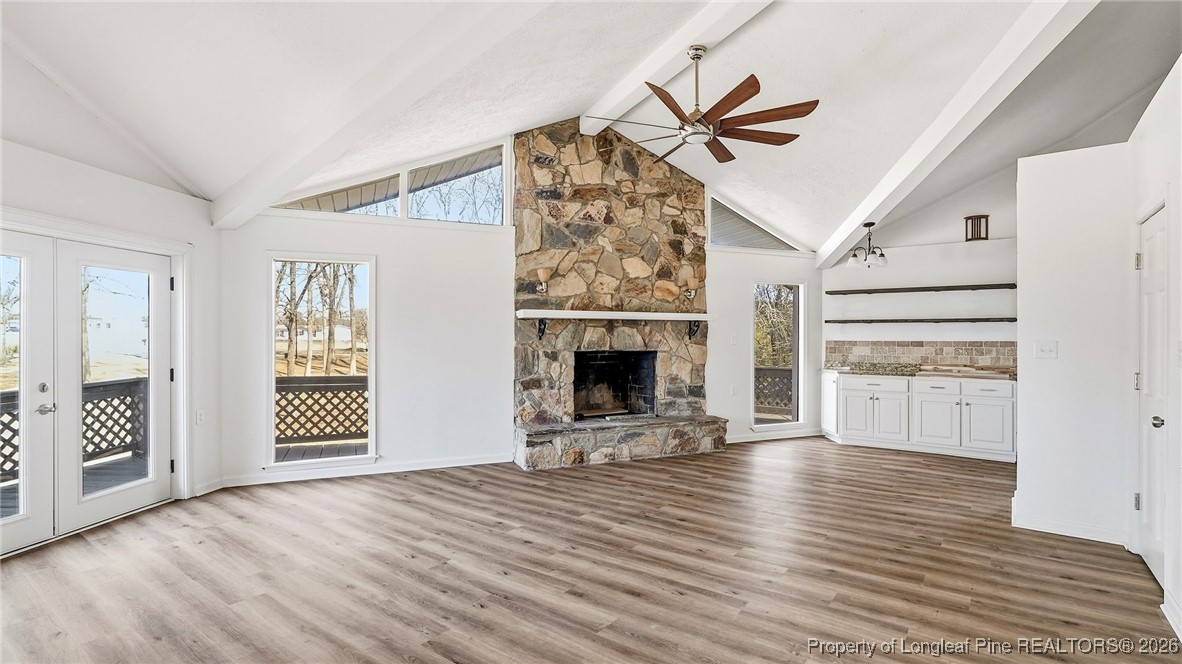10765 Barker 10 Mile Road St. Pauls, NC 28384 - Photo 6 of 48 an empty room with windows and fireplace