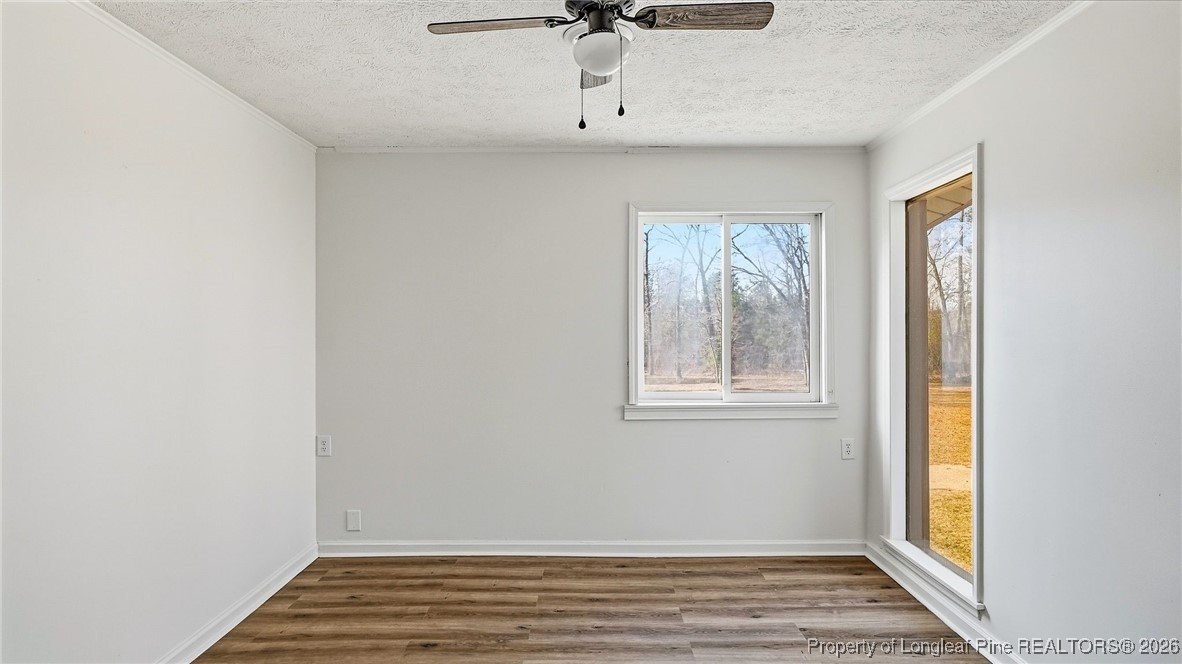 10765 Barker 10 Mile Road St. Pauls, NC 28384 - Photo 10 of 48 a view of an entryway with wooden floor and cabinet
