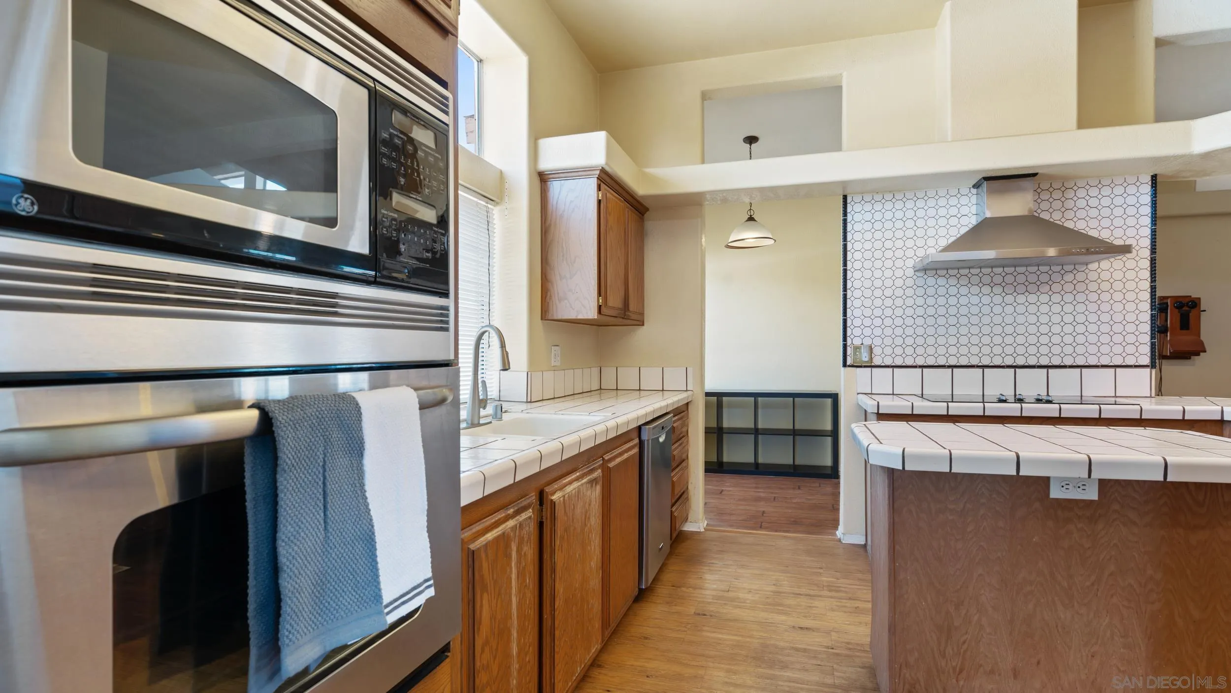 2075 Boulder Oaks Road Potrero, CA 91963 - Photo 12 of 41 a kitchen with stainless steel appliances granite countertop a stove and a microwave