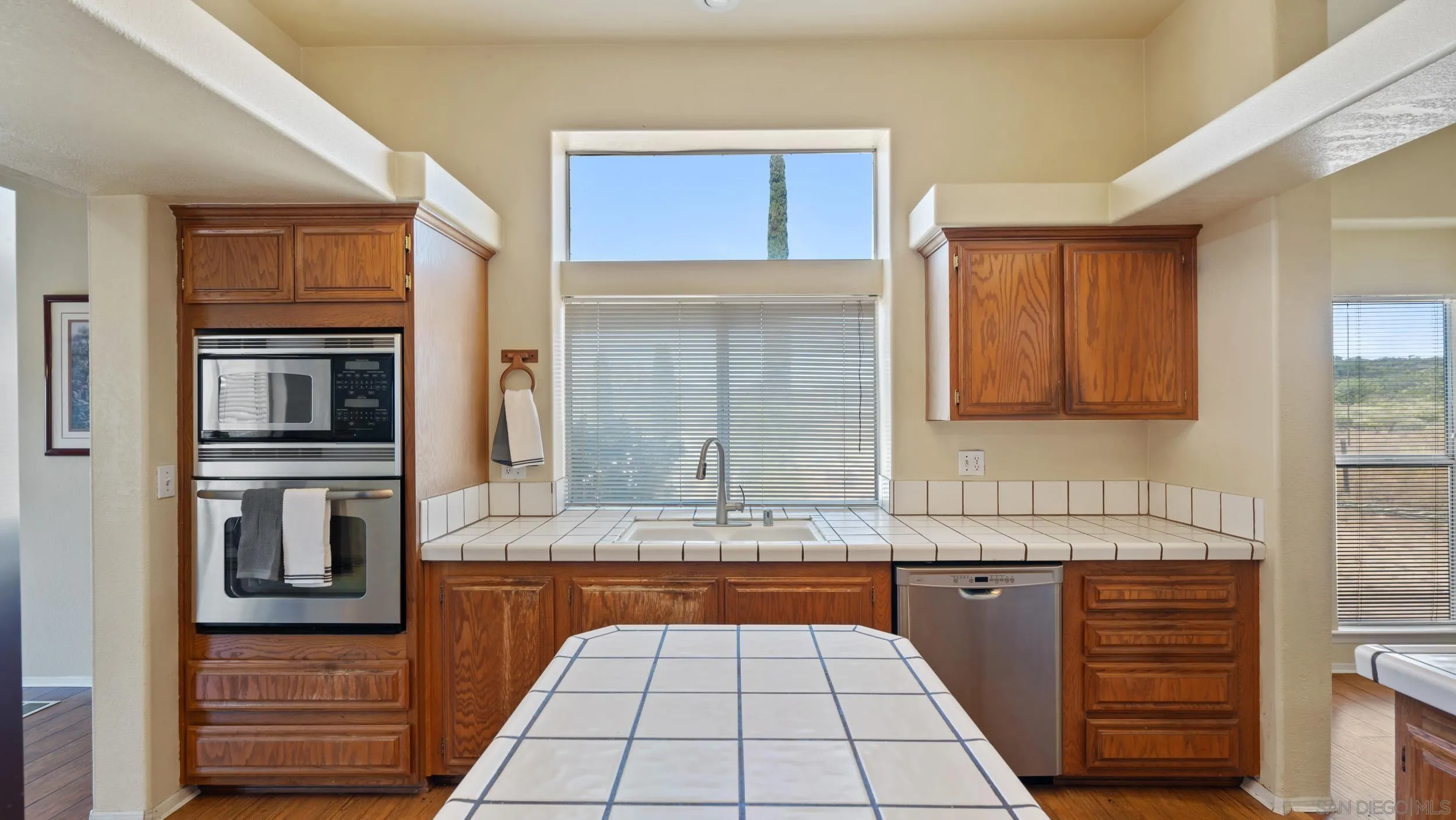 2075 Boulder Oaks Road Potrero, CA 91963 - Photo 13 of 41 a kitchen with granite countertop a sink and cabinets