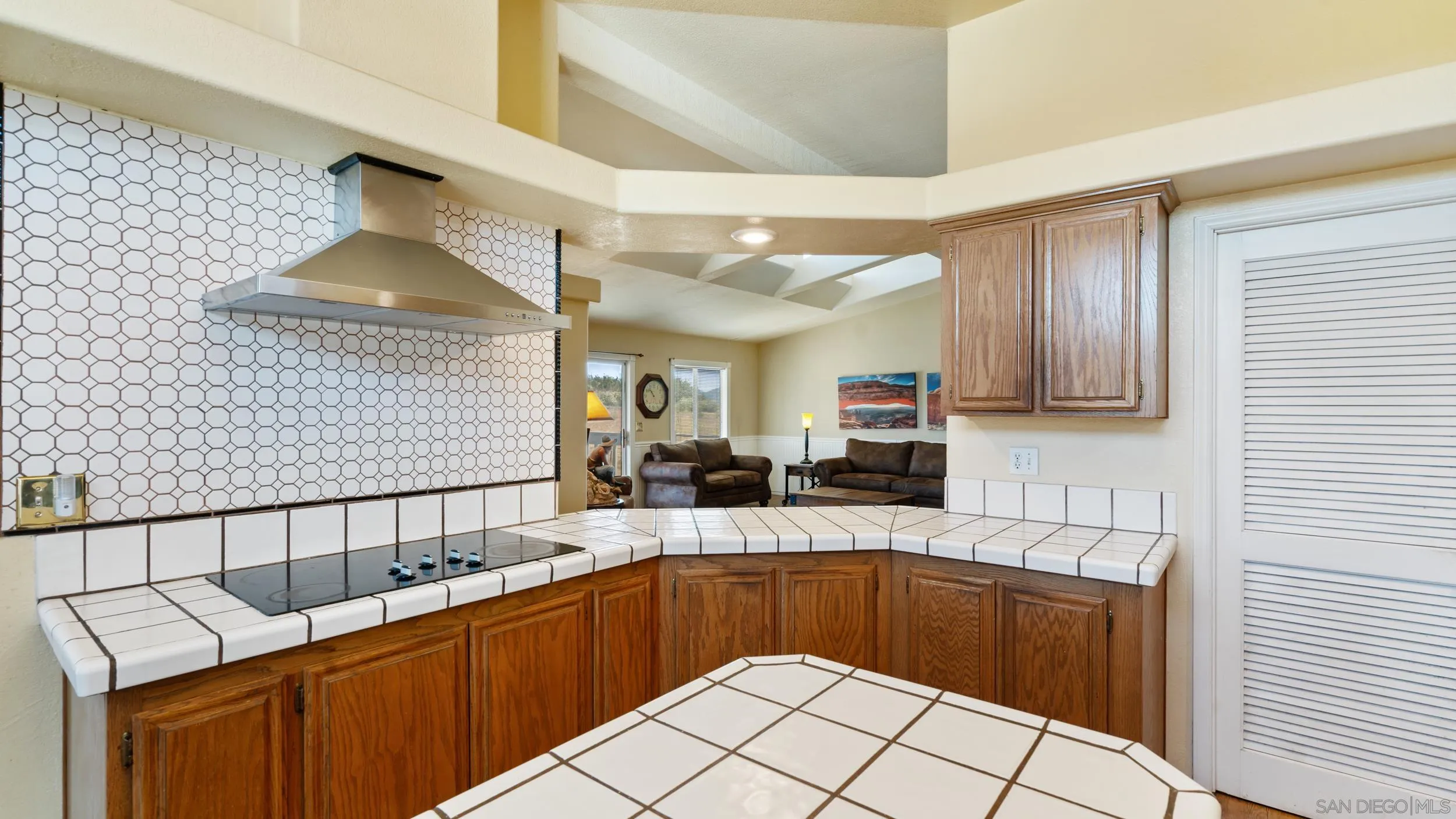2075 Boulder Oaks Road Potrero, CA 91963 - Photo 15 of 41 a kitchen with stainless steel appliances granite countertop a sink and cabinets