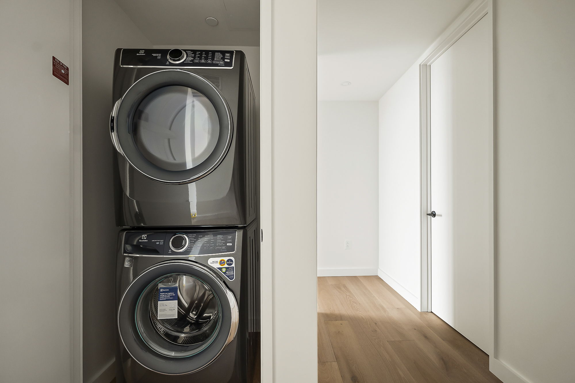610 Davis Street, Unit 2812 Austin, TX 78701 - Photo 15 of 32 a view of a hallway with washer and dryer