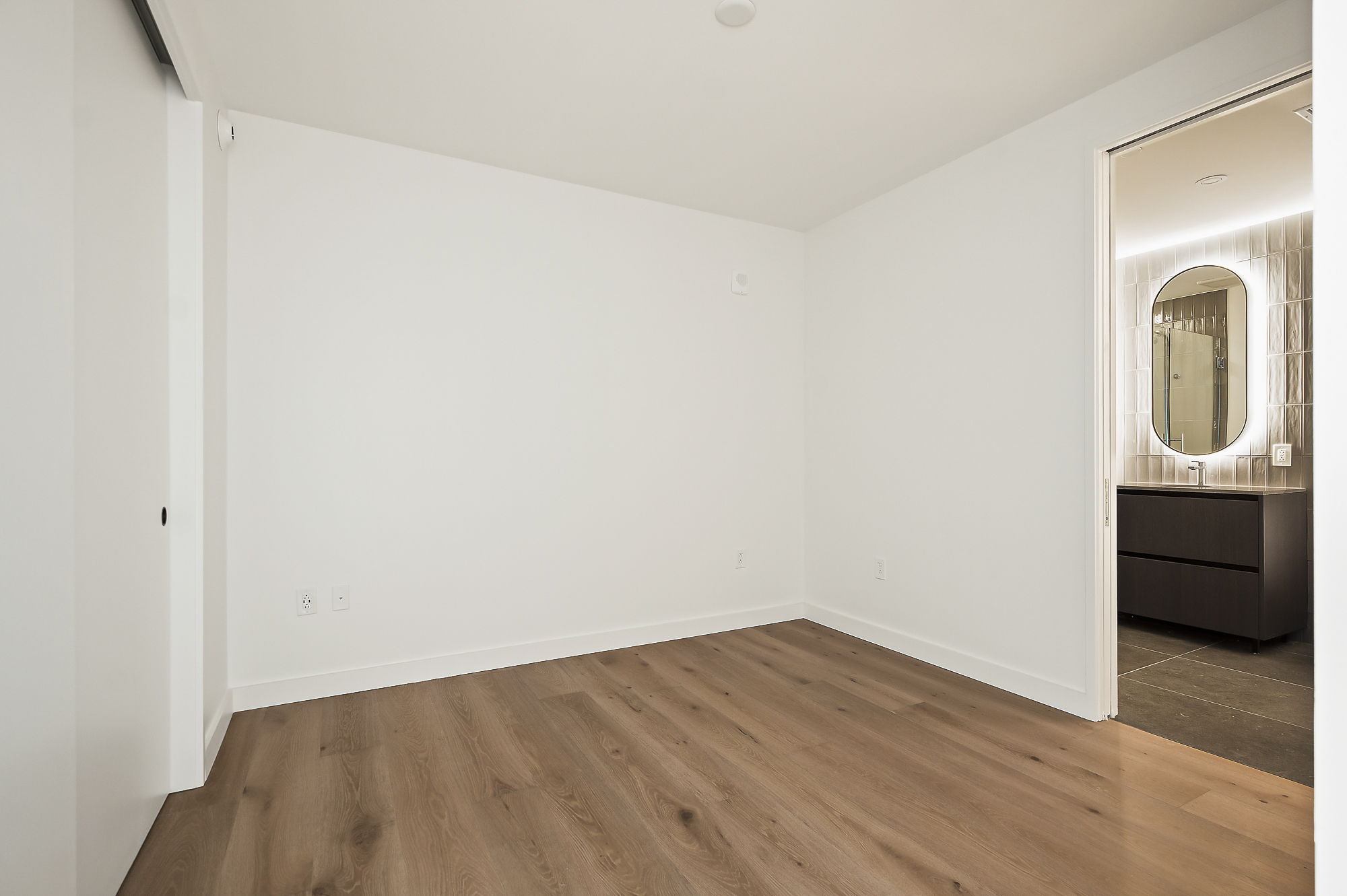 610 Davis Street, Unit 2812 Austin, TX 78701 - Photo 18 of 32 a view of a small space with wooden floor and a sink