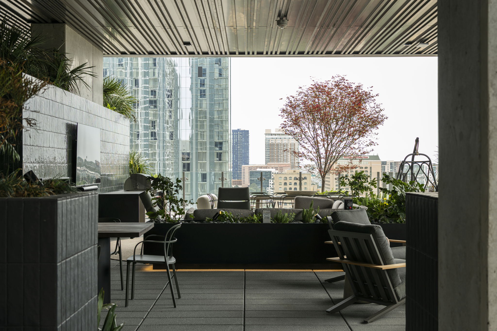 610 Davis Street, Unit 2812 Austin, TX 78701 - Photo 21 of 32 a view of balcony with chairs and a potted plant
