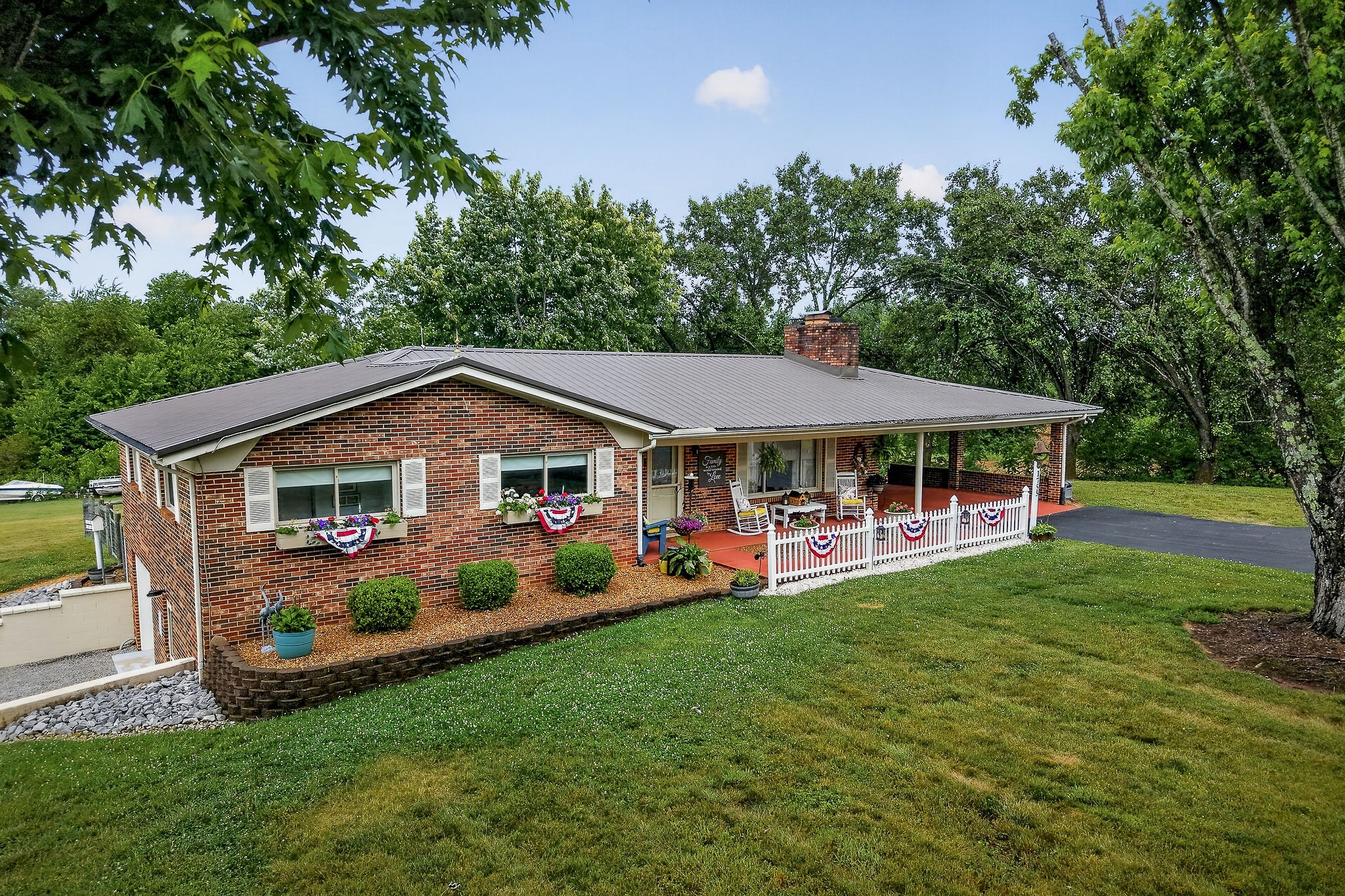 1755 Burgess Falls Road Sparta, TN 38583 - Photo 3 of 56 a front view of a house with a yard