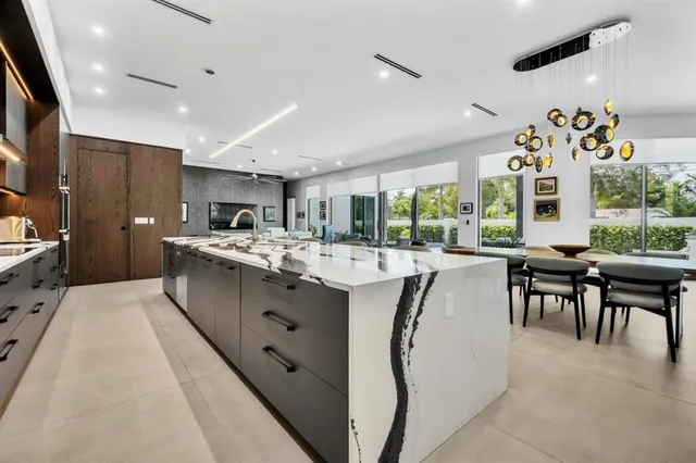 a large white kitchen with lots of counter top space