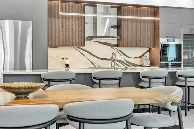 a large white kitchen with a large window