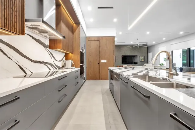 a utility room with stainless steel appliances and a window