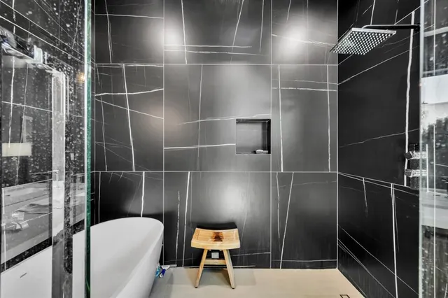 a bedroom with a bed couch and window