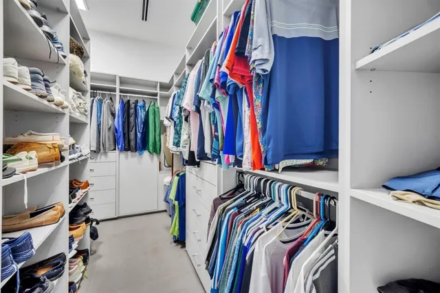 a bedroom with bed and tv