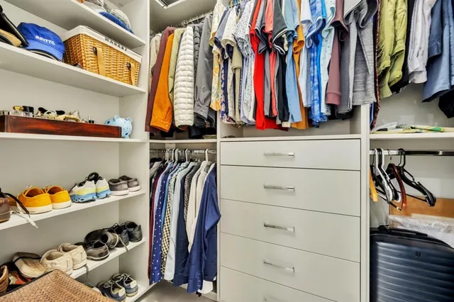 a bedroom with a bed couch and window
