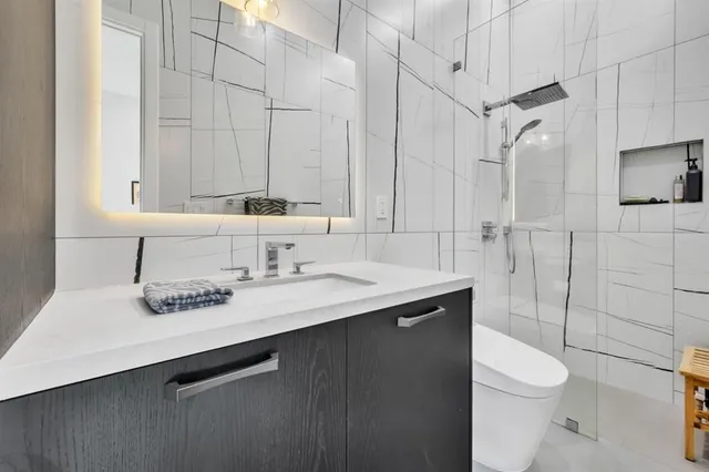 a bedroom with a large bed and a couch