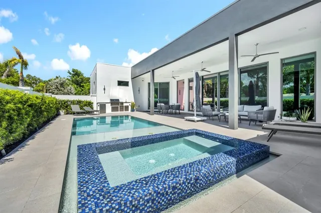 a kitchen with granite countertop a stove and a refrigerator