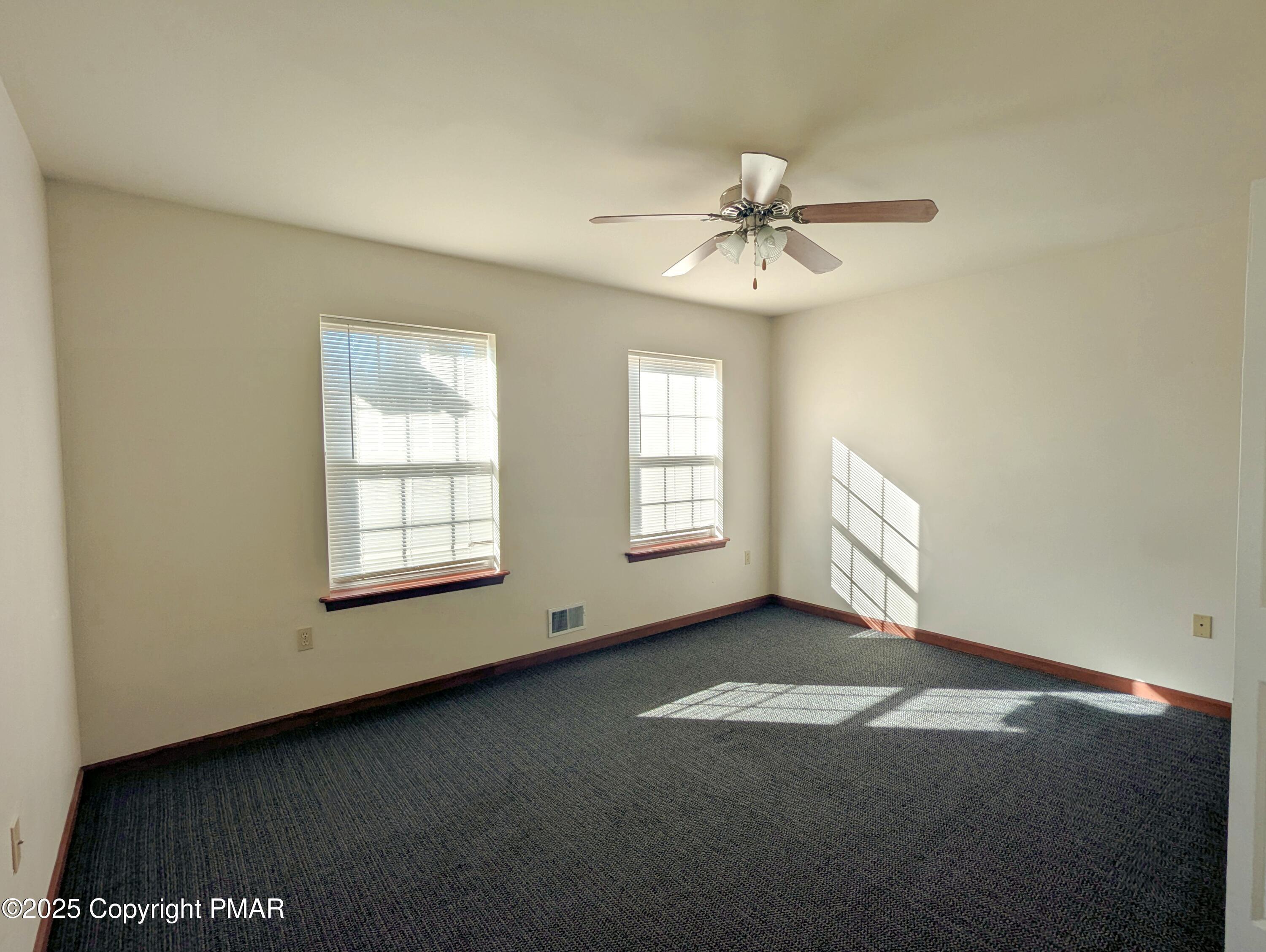 1603 Rachel Road Stroudsburg, PA 18360 - Photo 24 of 33 an empty room with windows and fan
