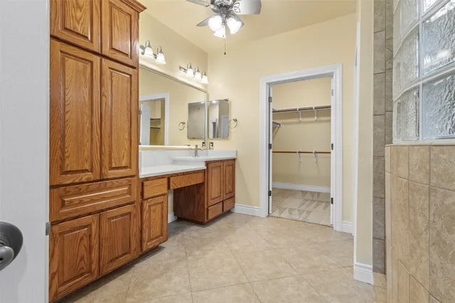 a bathroom with a double vanity sink a mirror and a shower