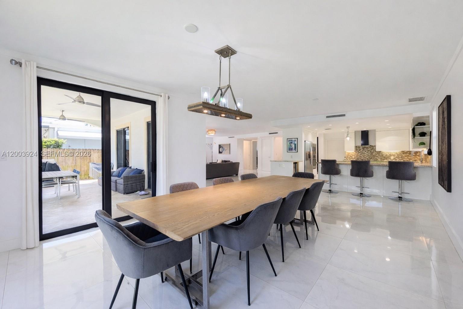 471 Southwest 30th Road Miami, FL 33129 - Photo 13 of 39 a view of a dining room with furniture window and wooden floor