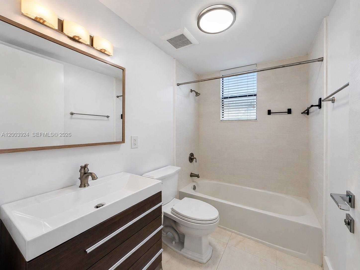 471 Southwest 30th Road Miami, FL 33129 - Photo 17 of 39 a bathroom with a sink a toilet and a bathtub