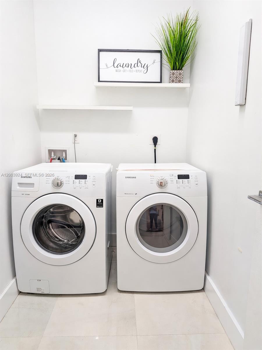 471 Southwest 30th Road Miami, FL 33129 - Photo 23 of 39 a utility room with dryer and washer