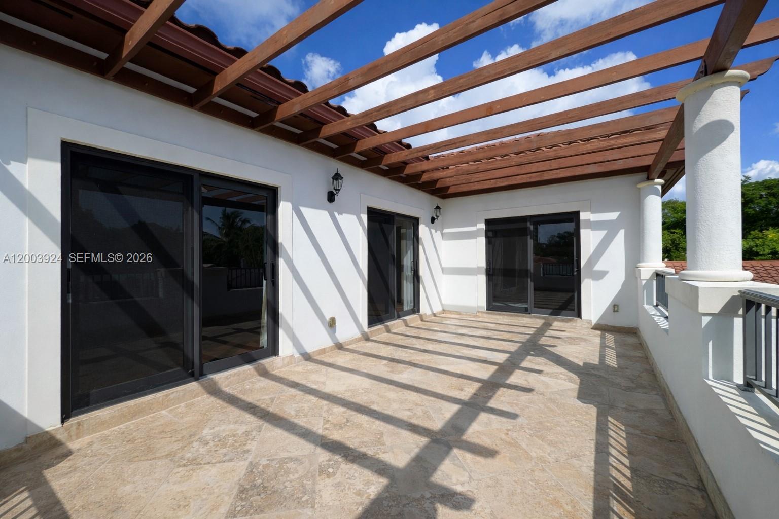 471 Southwest 30th Road Miami, FL 33129 - Photo 24 of 39 a bedroom with a bed and a large window
