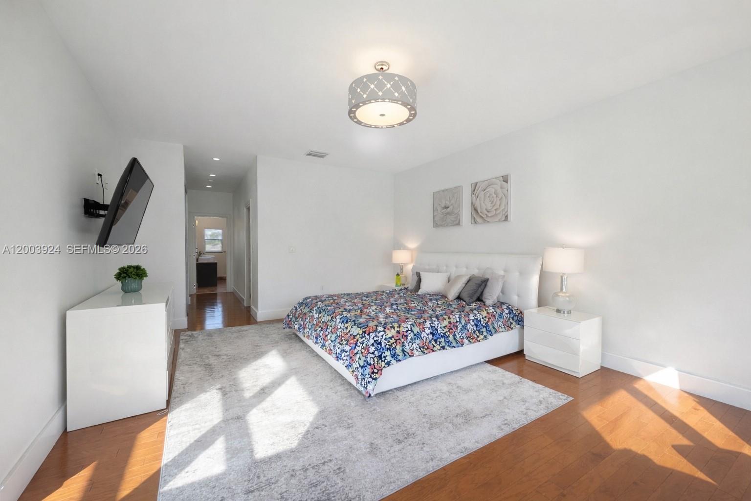 471 Southwest 30th Road Miami, FL 33129 - Photo 28 of 39 a bedroom with a bed and a potted plant