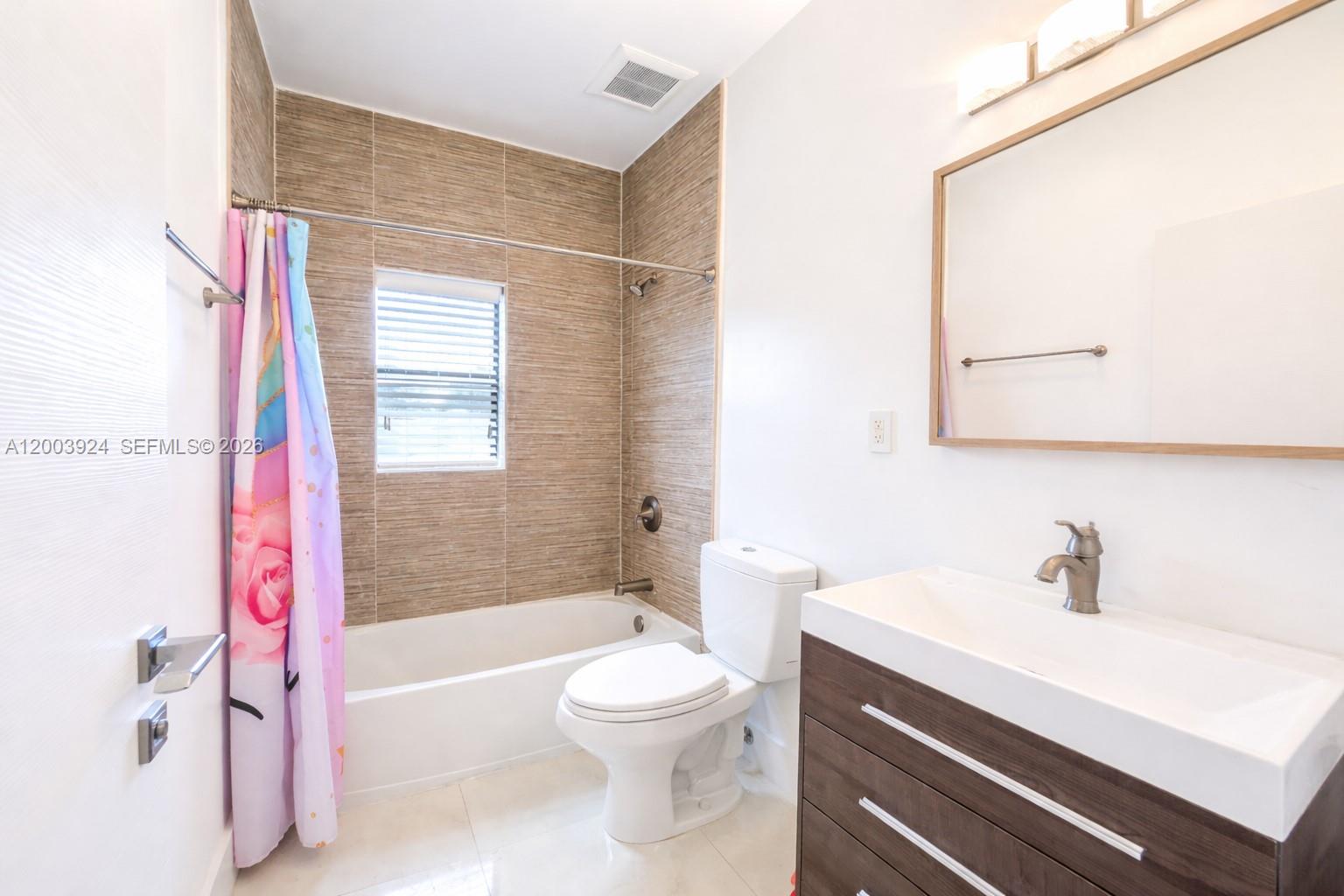 471 Southwest 30th Road Miami, FL 33129 - Photo 33 of 39 a bathroom with a sink a toilet and a bathtub