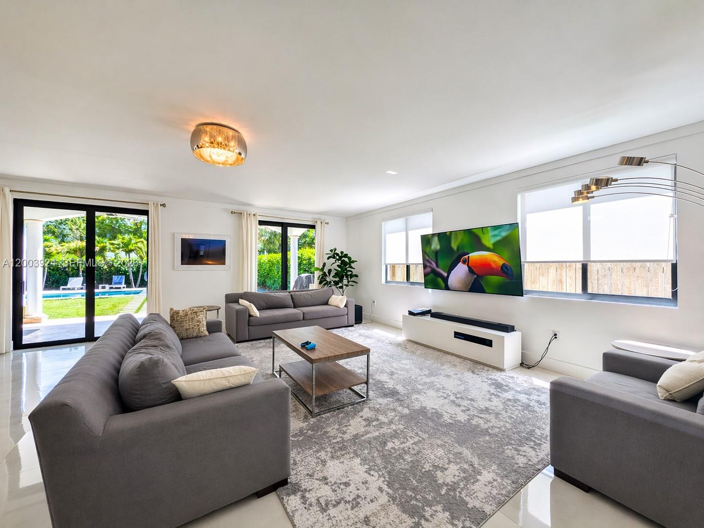 471 Southwest 30th Road Miami, FL 33129 - Photo 5 of 39 a living room with furniture a rug and a large window