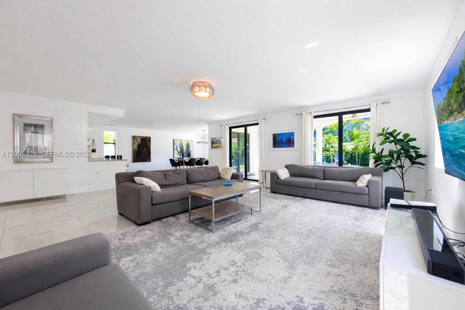 471 Southwest 30th Road Miami, FL 33129 - Photo 6 of 39 a living room with furniture and a potted plant