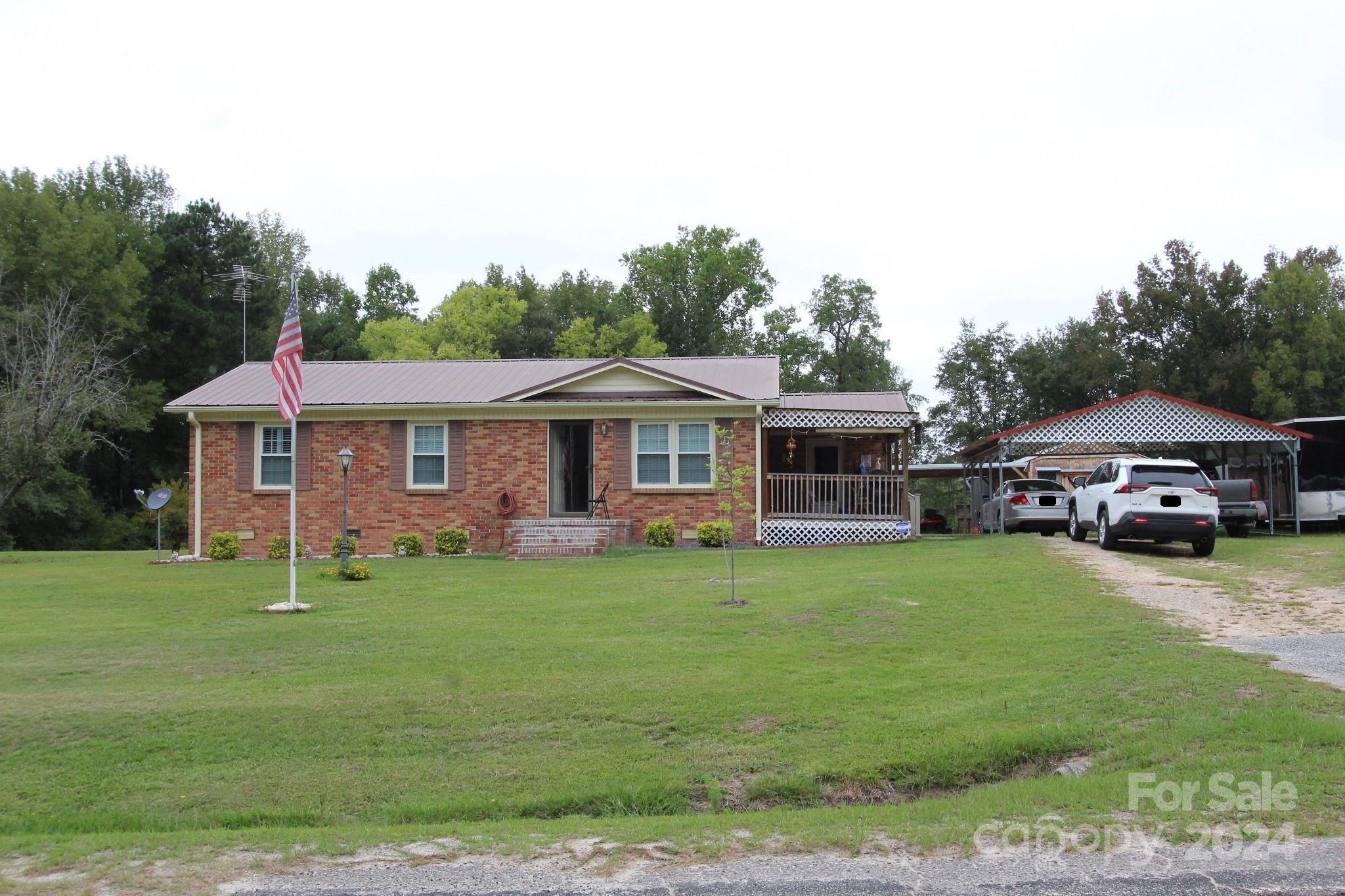 188 Land Of Promise Road Chesterfield, SC 29709 - Photo 1 of 27 a front view of a house with a garden
